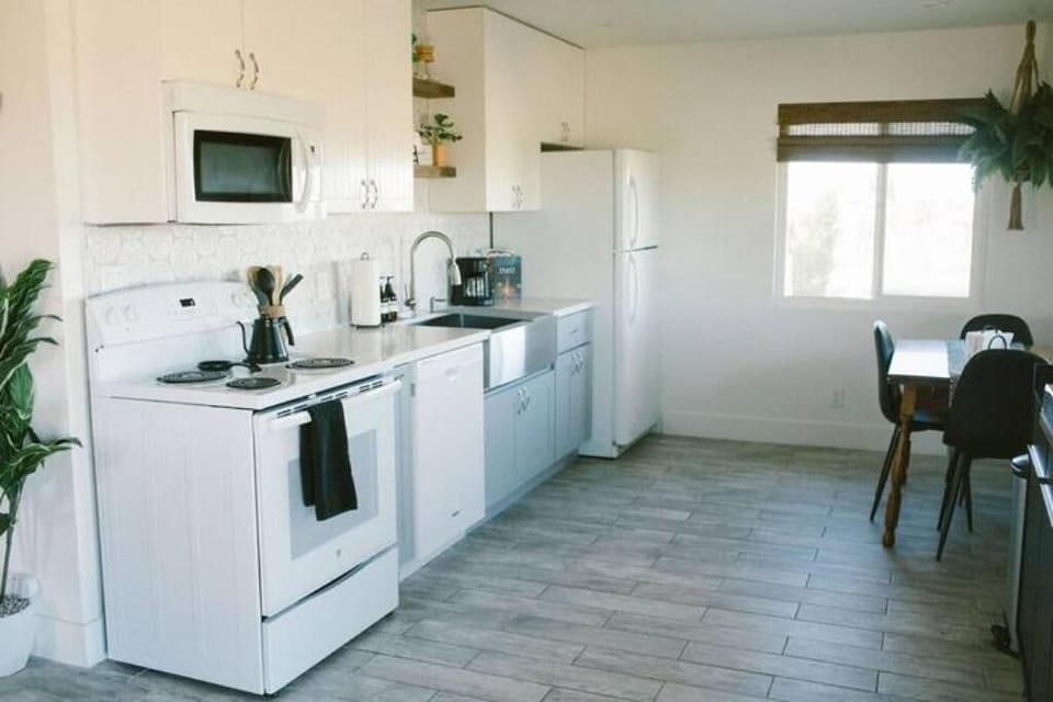 Open kitchen with dining table. 