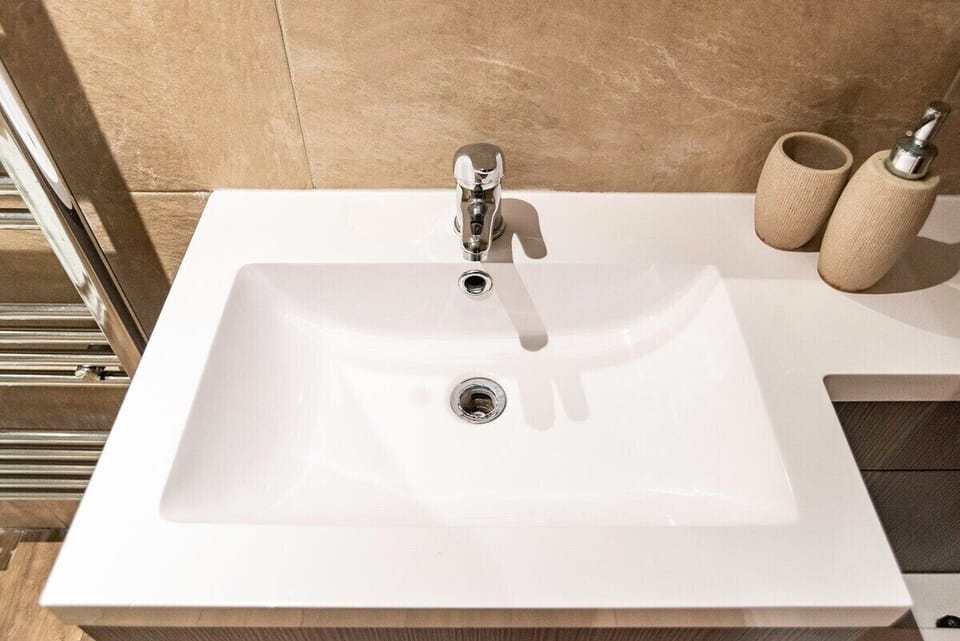 A bright and spacious bathroom finished in a clean, modern style.

