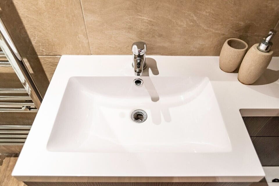 A bright and spacious bathroom finished in a clean, modern style.
