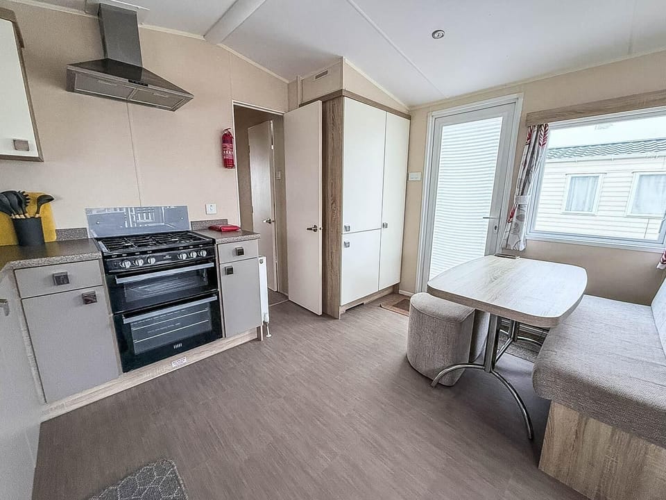 For last minute weekend getaways, head to Pakefield, Suffolk, UK, and unwind at Pakefield Holiday Park, featuring cosy caravans with a comfortable kitchen area.