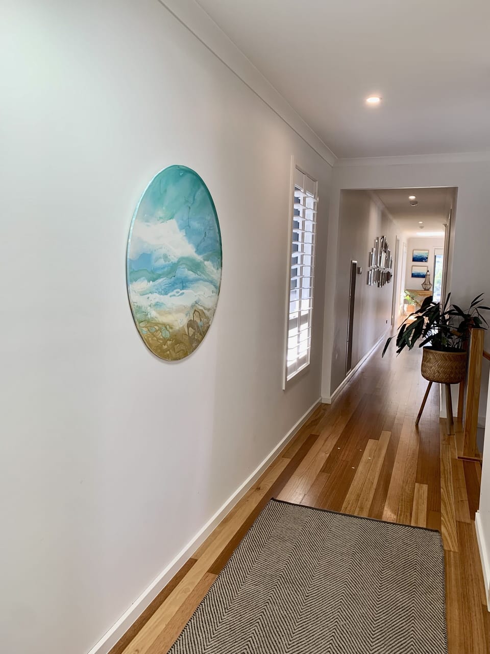Hallway leads to parent’s retreat. 5 bedrooms are off this hallway.