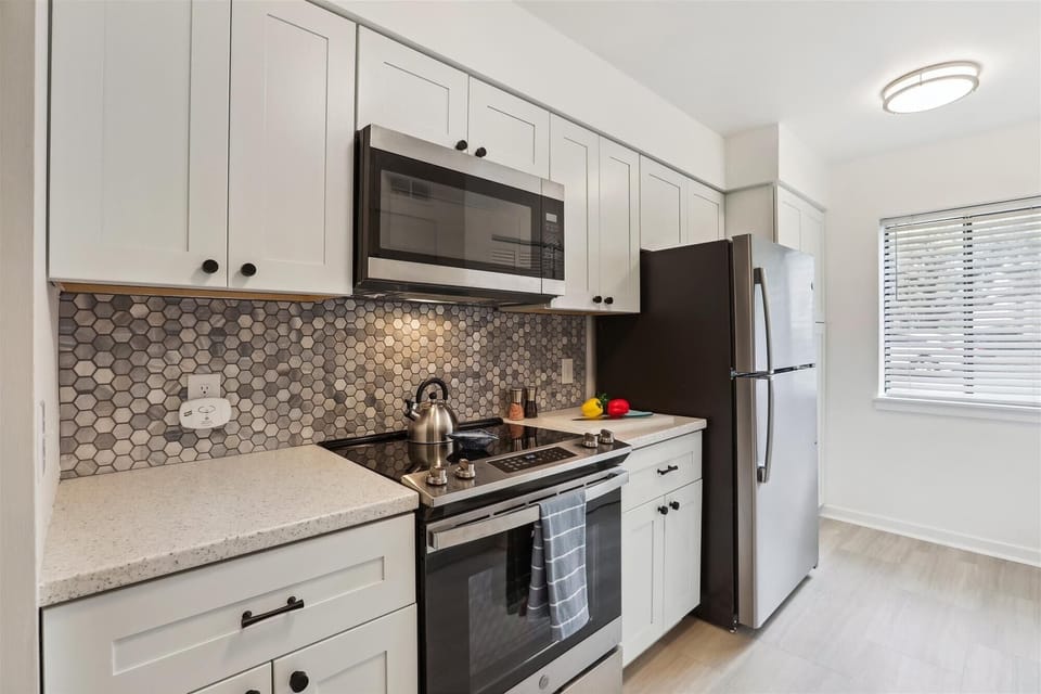 New cabinets and modern stainless appliances