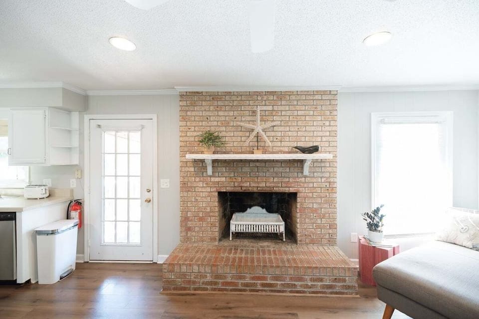 Bright and airy open-concept living space with comfortable seating and a Smart TV