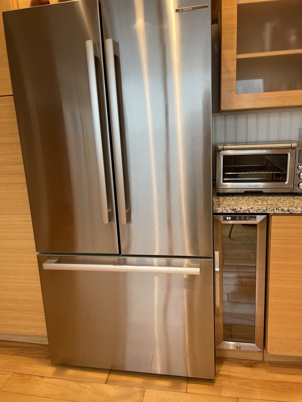 New refrigerator and adjacent wine fridge