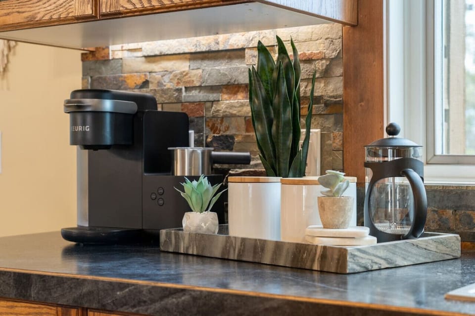 Full kitchen, located on the main floor, with an island and dedicated dining area.