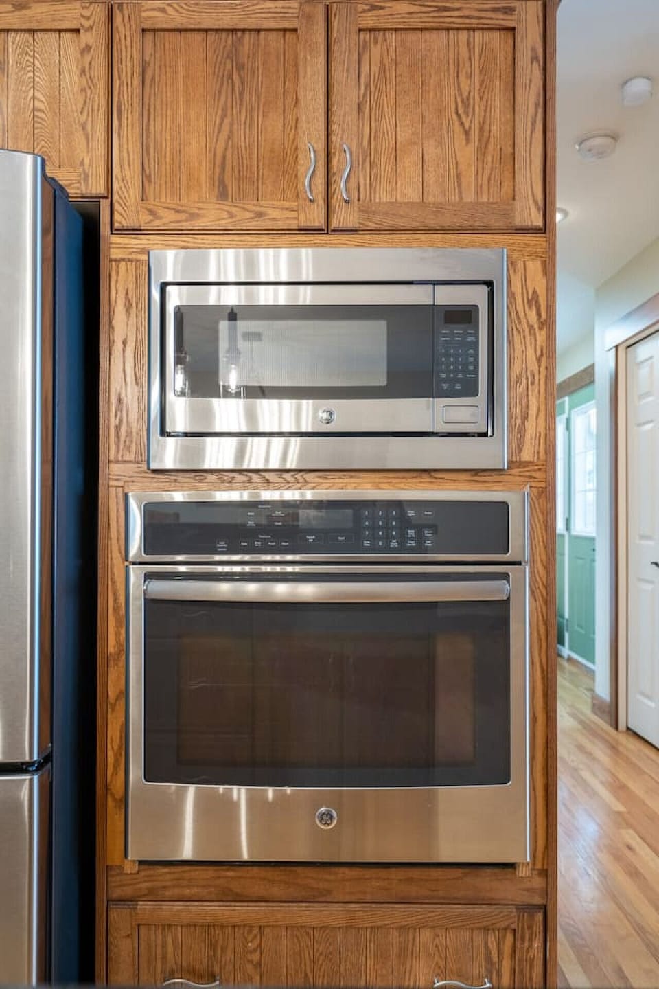 Full kitchen, located on the main floor, with an island and dedicated dining area.