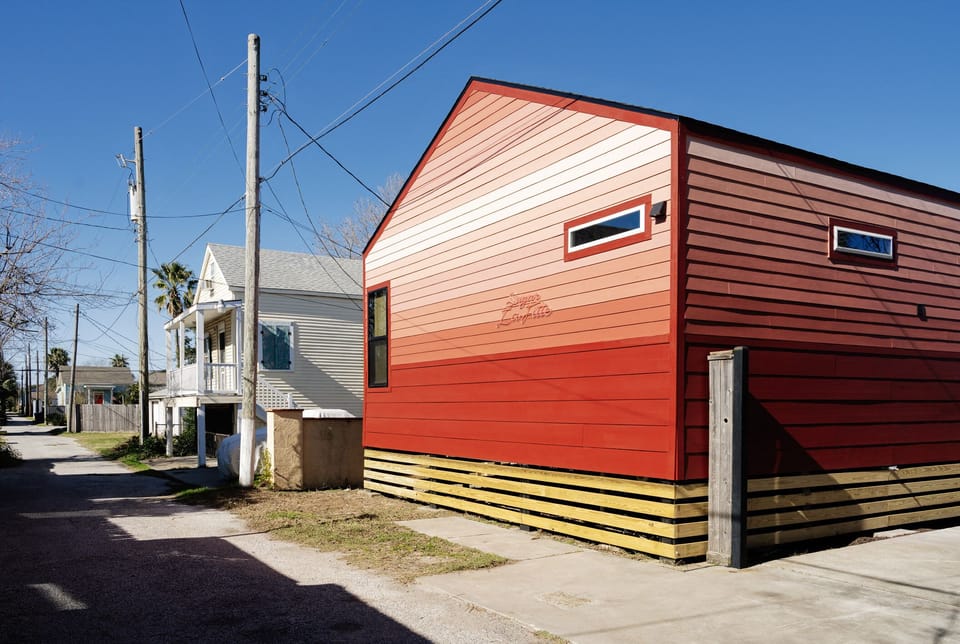 A Get-A-Way Tucked in the alley. "Sugar LaFitte," an inspiration from The Famous Galveston/New Orleans Pirate and His Red House - "LA MAISON ROUGE" - con Elvis Flare