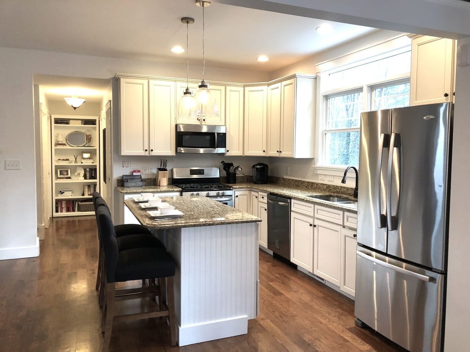 Open concept kitchen/living room/dining area. Fully stocked kitchen.