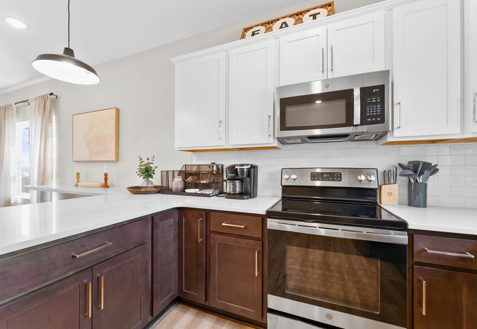 Another view of the kitchen, showcasing the spacious layout and modern appliances that make cooking a breeze.