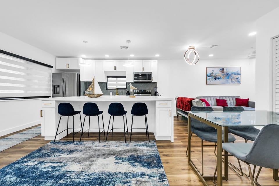 Dining area with hightop bar seating and glass table top seating available 