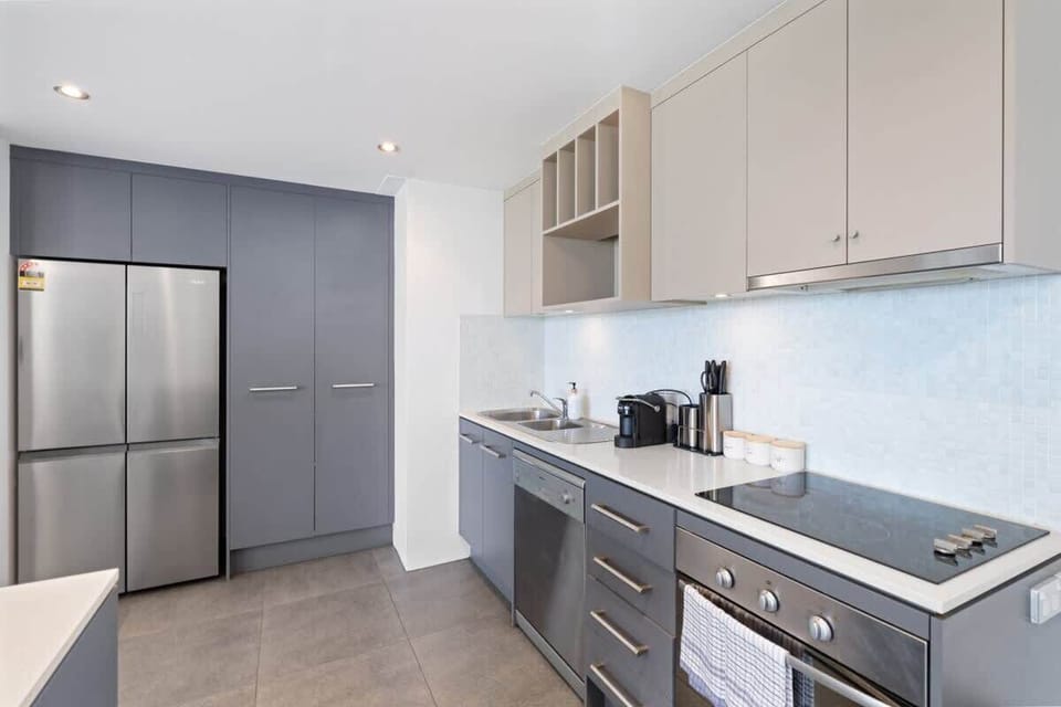 Fully equipped kitchen with brand new appliances and complimentary essentials such as cooking oil and coffee.