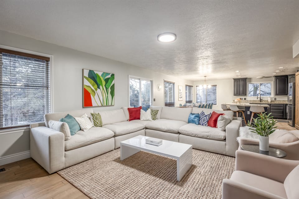 Enjoy your time in our living room with ample seating for all and a 65-inch TV.