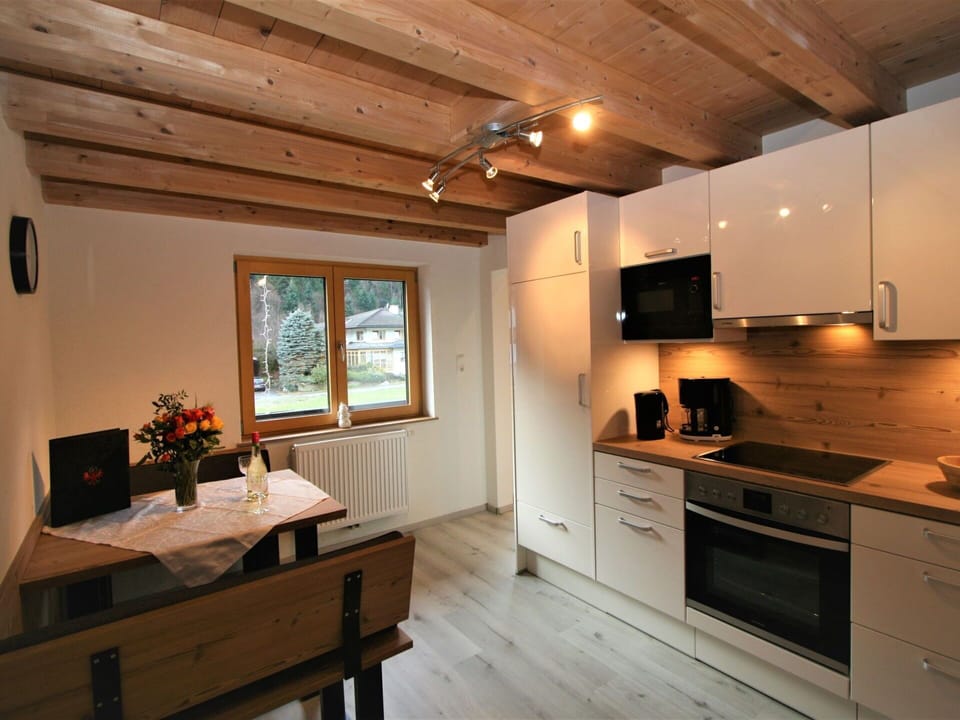 Furniture, Cabinetry, Property, Plant, Countertop, Building, Houseplant, Window, Wood, Lighting