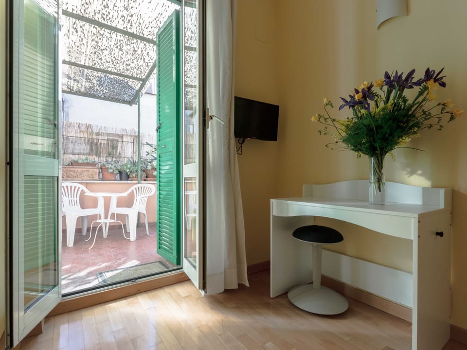 Bedroom with terrace access, TV and work table