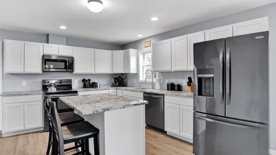 Modern Fully Equipped Kitchen with Stainless Appliances