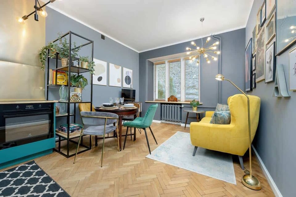 A full view of the living and dining area with a bright, eclectic interior.

