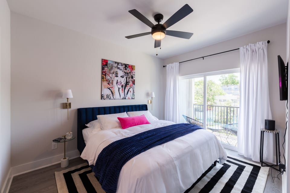 Third floor primary bedroom w king bed & en suite bathroom w private balcony