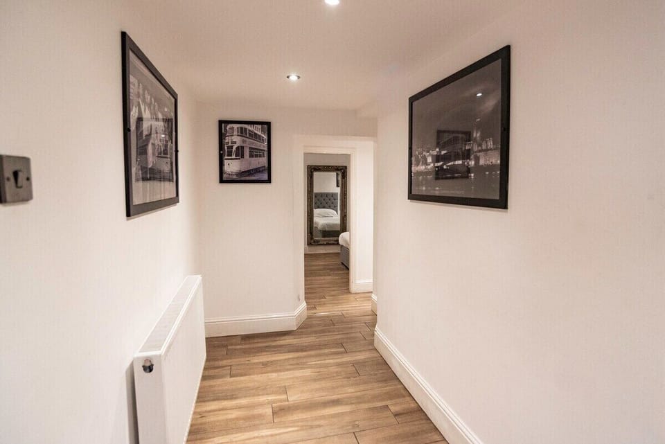 Our hallways are large, bright and beautifully finished, creating a warm first impression from the moment you step inside.

With stylish flooring, clean neutral décor and generous space throughout, they feel open, airy and welcoming. The layout allows guests to move comfortably between rooms, whether arriving with luggage or settling in as a group — setting the tone for a relaxed and spacious stay.