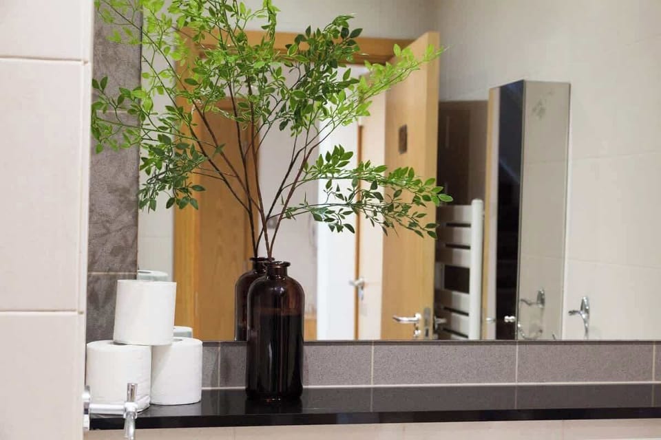 The large open hallway features an accessible and well-stocked store cupboard, along with convenient coat hooks. This setup is especially beneficial for longer stays, allowing for organized storage and easy access to essentials.