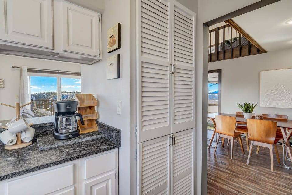The cozy kitchen sits just to the left of the dining area, with essentials to make homemade meals together.