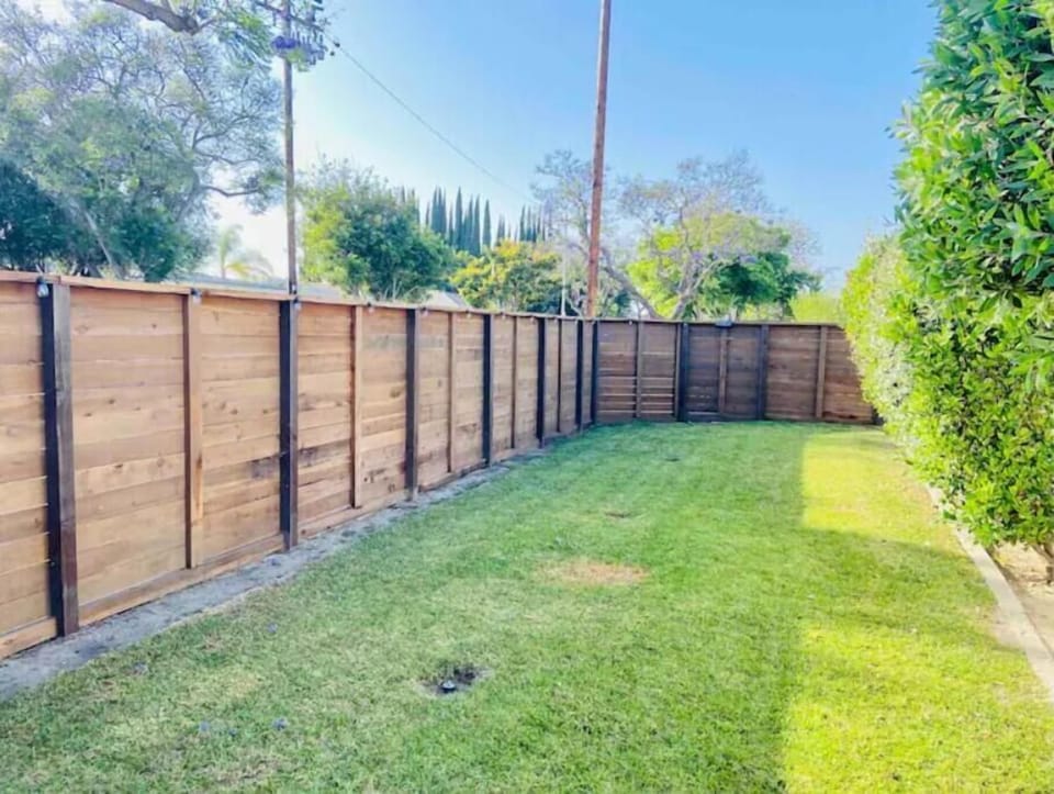 Side grass yard- throw a football with your family!