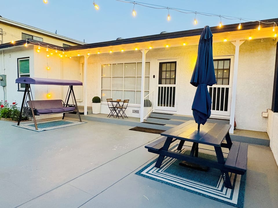 Unwind after a day of exploring in your spacious backyard under charming lights!