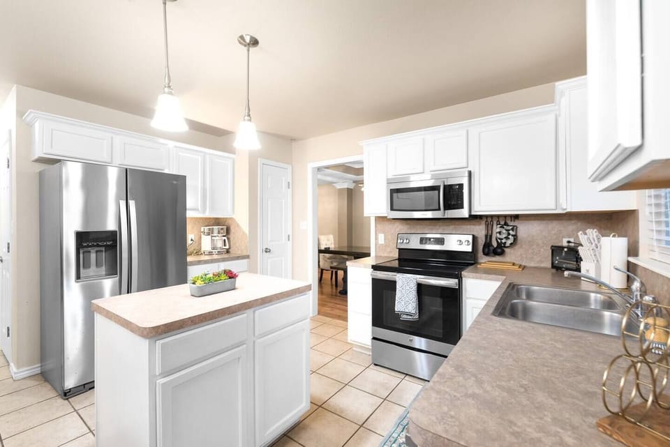 Cook and entertain with ease in this chic, fully-equipped kitchen.