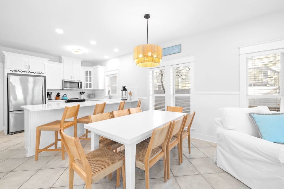 Dining room table seats 8 with an additional 4 seats at the kitchen island.