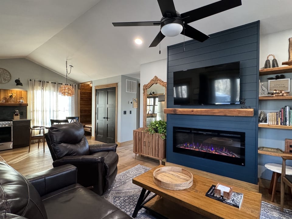 Living room with fireplace and TV