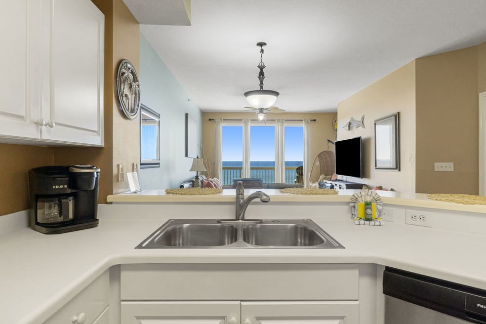 The fully equipped kitchen features stainless-steel appliances, and everything you need to cook meals for family and friends.