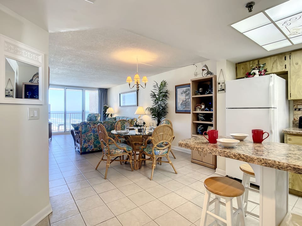 Bright, airy layout with dining and kitchen flowing into the living area.