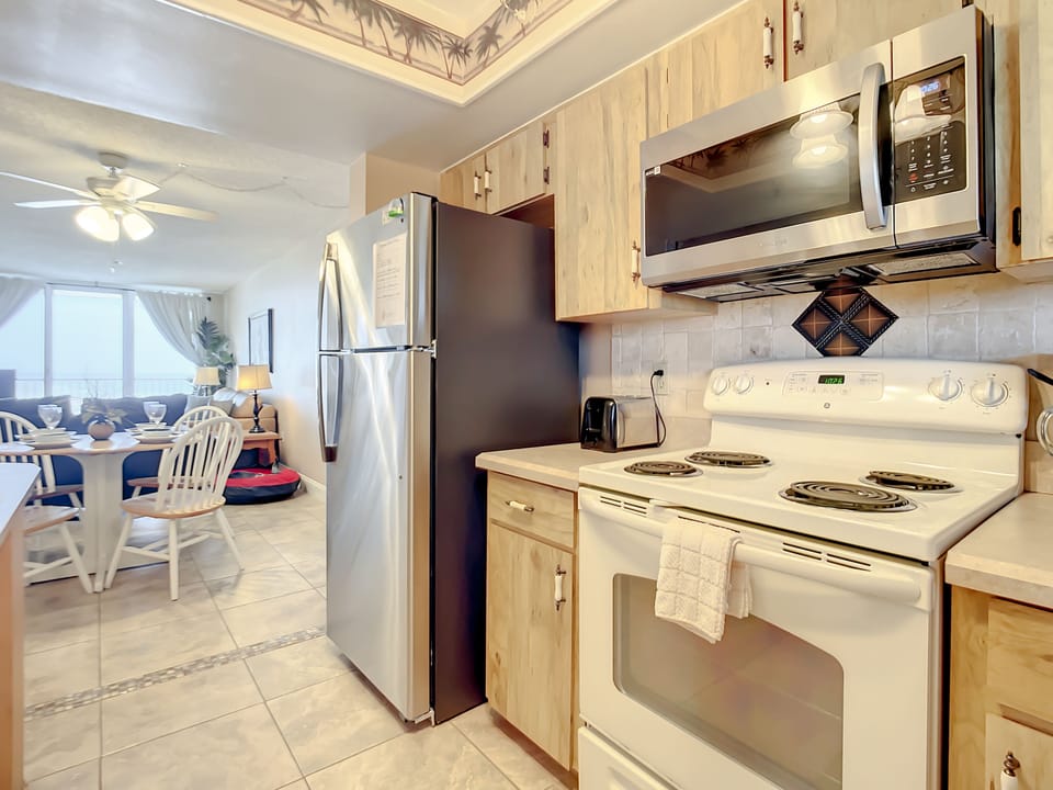 A well-lit kitchen opens to the dining and living areas for seamless entertaining.