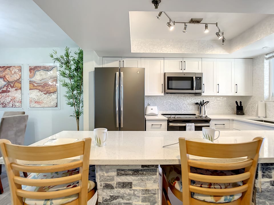 Cozy breakfast bar with stone detailing and comfortable seating, ideal for casual dining.