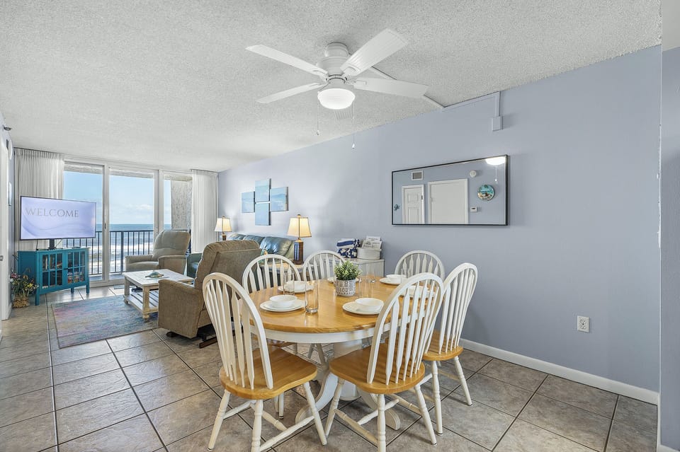 Enjoy ocean views while dining and unwinding in this bright, beach-themed space with cozy seating—perfect for a peaceful and memorable beachfront stay.