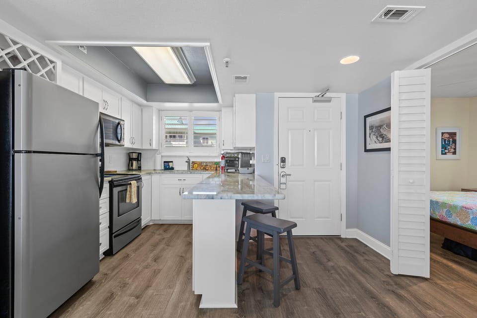 Newly renovated and ready for you! Our kitchen boasts a breakfast bar for added convenience and style.