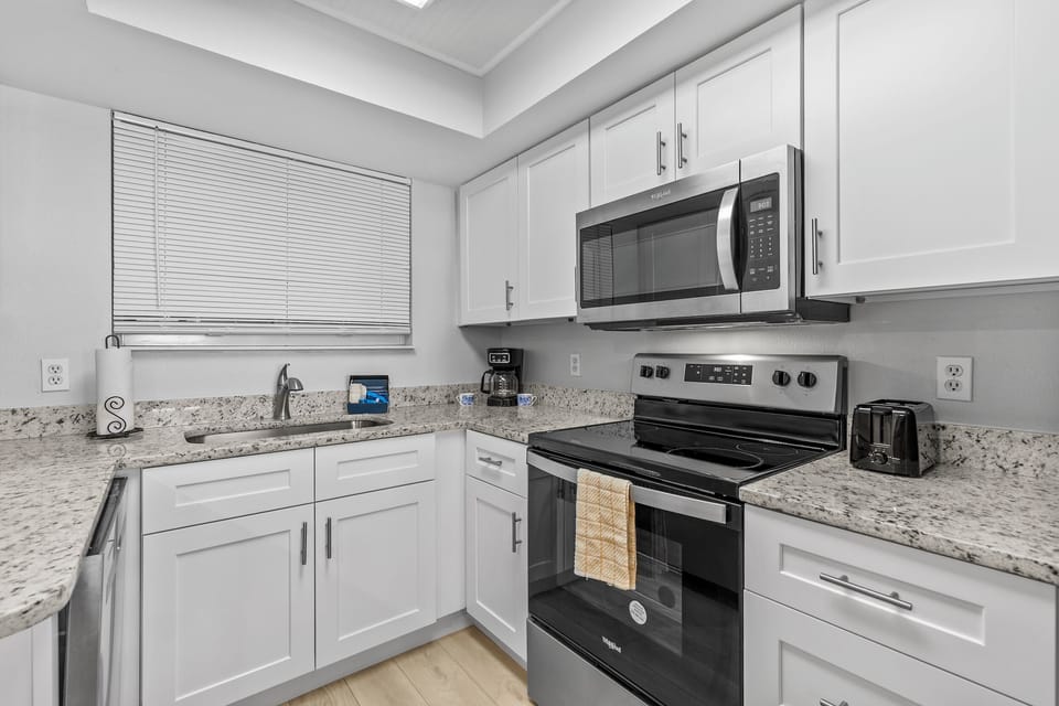 The kitchen offers a delightful view and includes everything you need to kickstart your vacation.
