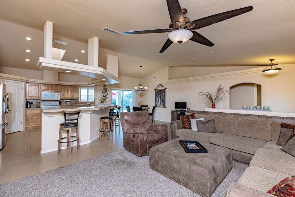 Open concept kitchen/dining/entertainment space.