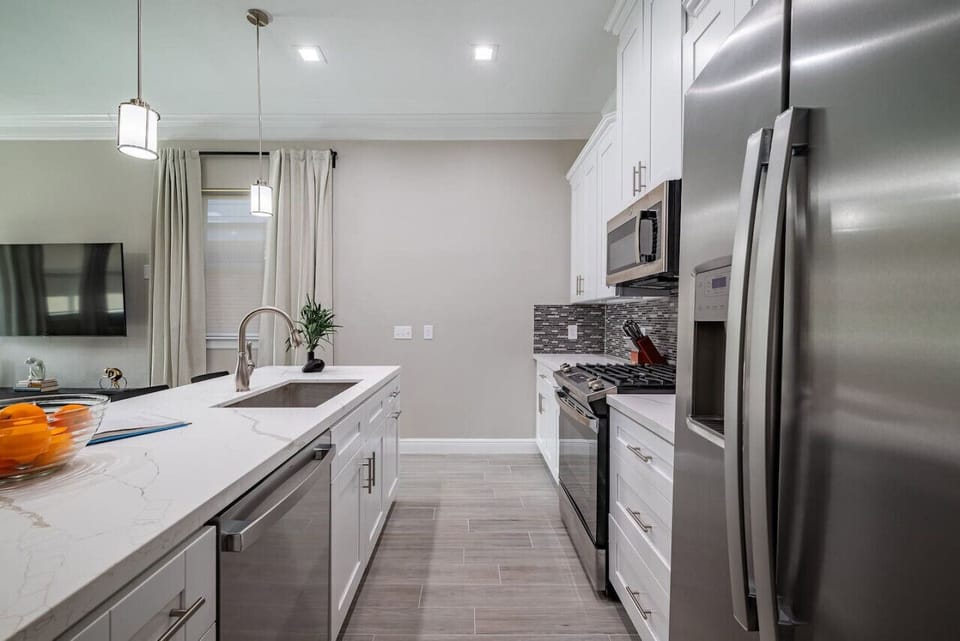 Double door fridge with filtered water and ice maker, also includes a coffee station not pictured here.