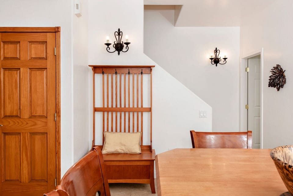 Dining area looking to half bath and stairwell