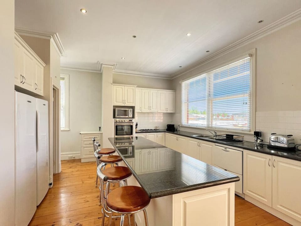 Kitchen with Island bench and everything you need for a comfortable stay