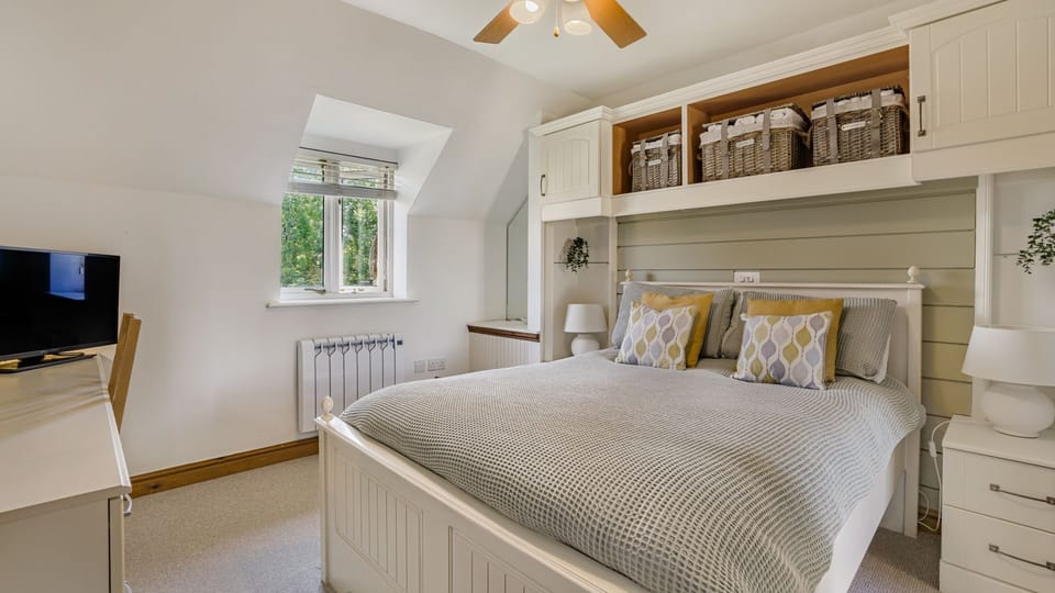 The calming decor of the Master is ideal for restful night's sleep after a busy day on the lake
