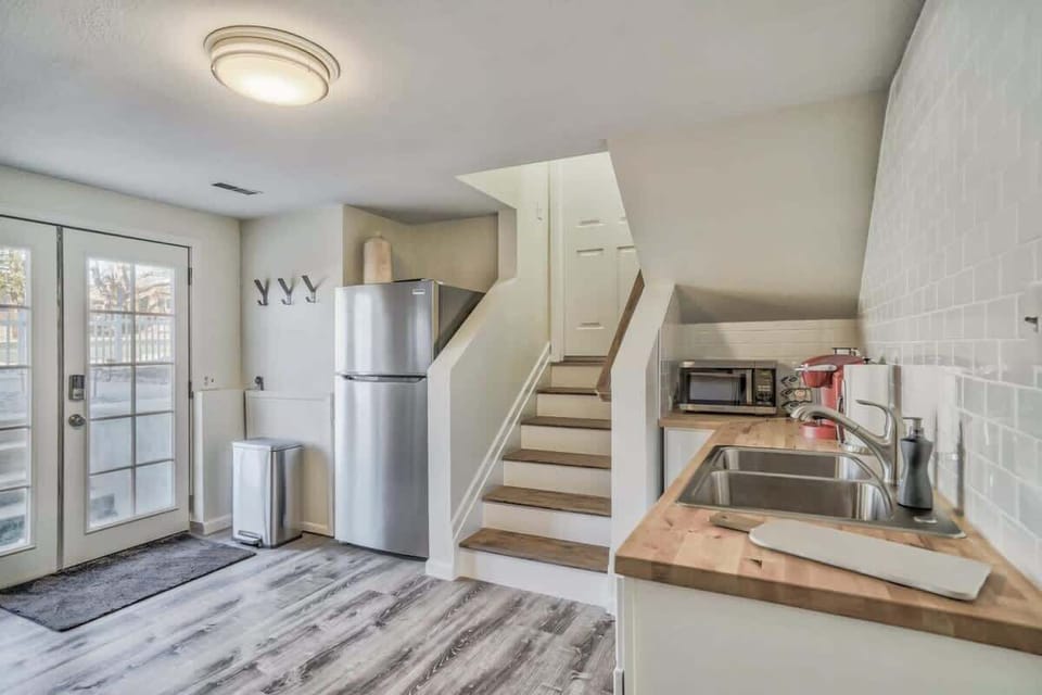 Kitchenette stocked with all the amenities to include an induction stovetop, microwave, cookware, drinkware, dinnerware, utensils, Keurig and more!