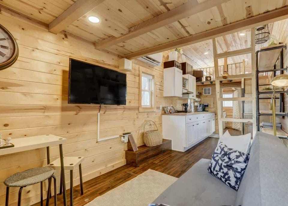 Nestle into comfort at Red Rock Roost's cozy living area – where relaxation meets charm in every corner.