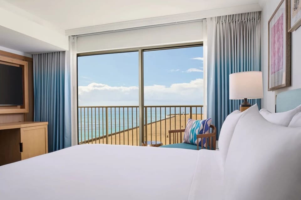 Wake up to sunrise views from crisp, cloud-soft linens.