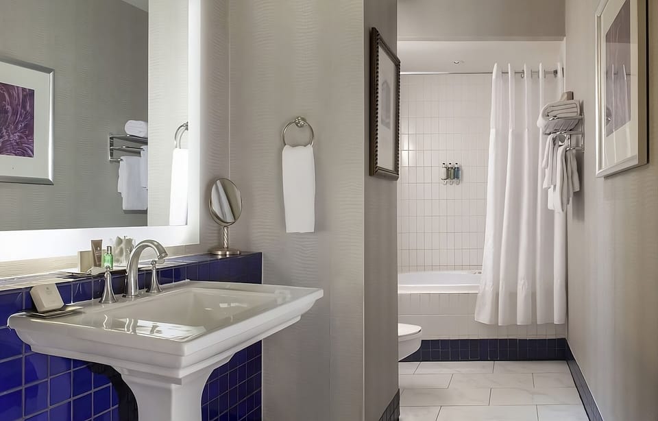 Refresh at a sleek vanity with bright, flattering mirror light.