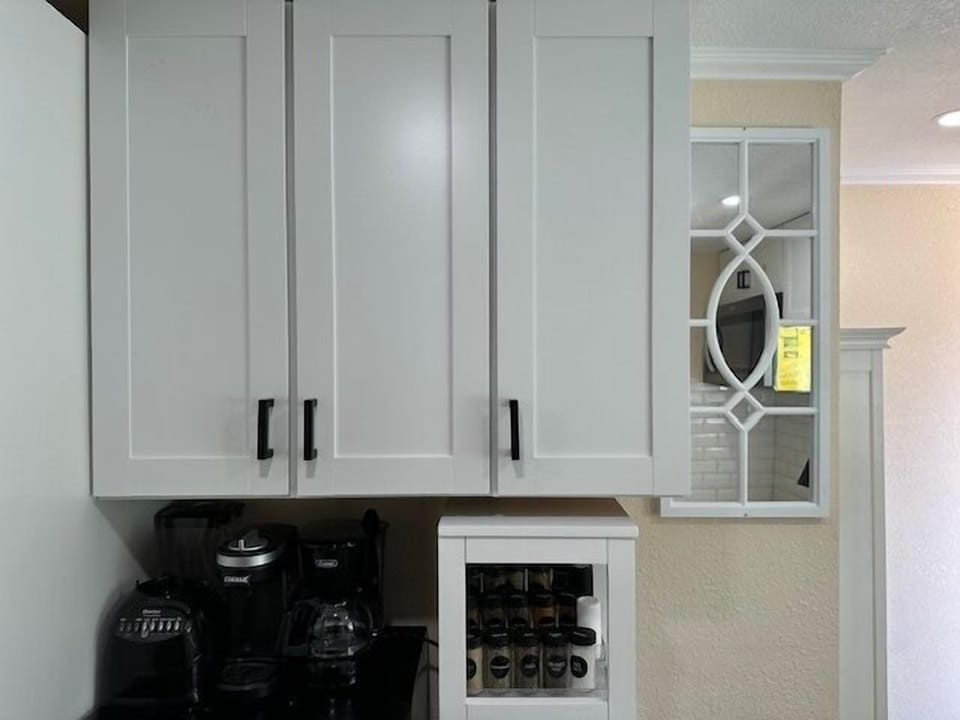 Some cabinets are empty so guests can tuck away their groceries & clothes
