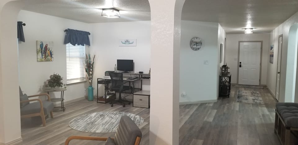 Dedicated desk with a monitor and extra power/USB ports. 