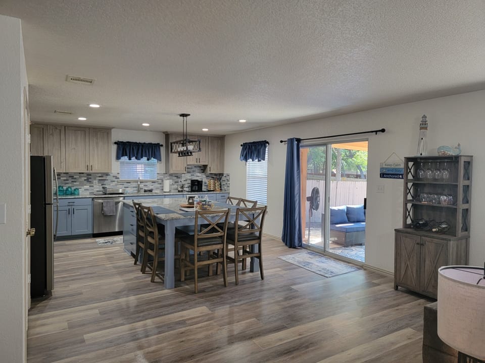 Sliding glass door to backyard seating and grilling area.