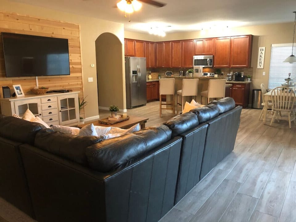 Open concept family room with 65” Tv
