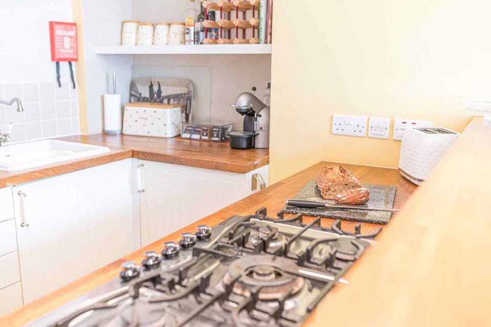 Fully equipped kitchen with gas hob, electric oven, microwave and Krups coffee machine